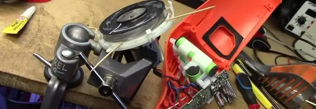 Vacuum cleaner repair parts and tools on a workbench in Phoenix, AZ